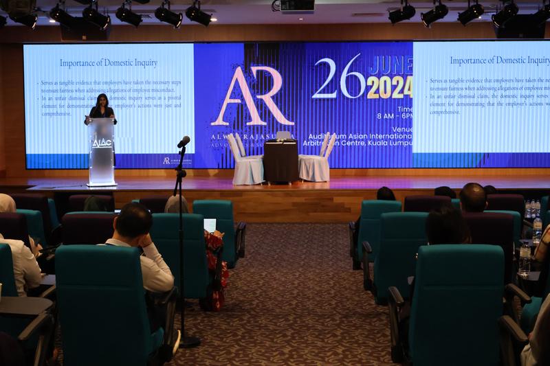 Speaker presenting on the importance of domestic inquiry at HR Transform 2024